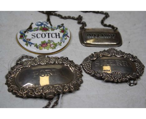 A Tiffany &amp; Co sterling silver decanter collar, annotated for Brandy, together with two other silver decanter collars for