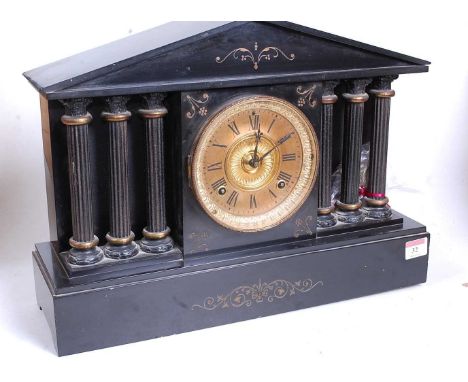 A Victorian black slate mantel clock, of architectural form, the gilt chapter ring showing Roman numerals, flanked by six Cor