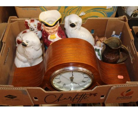 A box containing a collection of miscellaneous items, to include a 20th century quartz Napoleon's hat mantel clock, a pair of