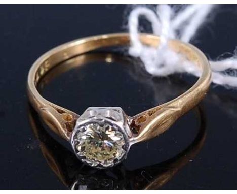 An 18ct gold and platinum diamond solitaire ring, the illusion set brilliant weighing approx 0.2 carats, 1.7g, size M