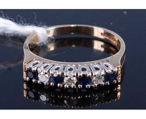 A 9ct gold, sapphire and diamond half hoop ring, having seven alternating round cut stones, 2.4g, size L