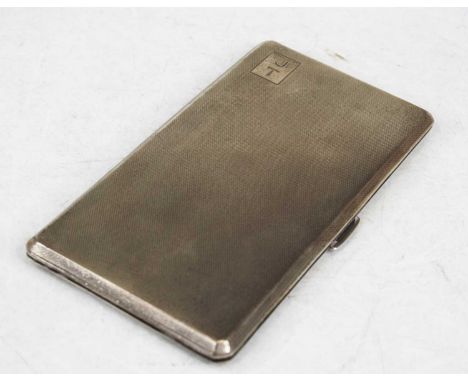 A George VI silver pocket cigarette case, of canted rectangular form having engine turned decoration, monogrammed cartouche a