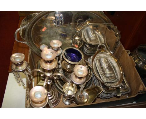 A box of miscellaneous metal wares to include silver plated twin handled serving tray, pair of brass candlesticks, candelabra