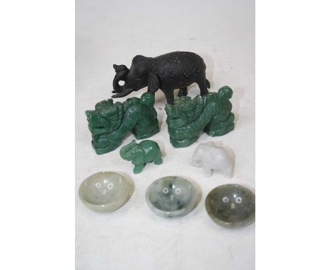 A pair of polished faux jade figures, each carved as a dragon, 6.5cm, together with two polished hardstone figures carved as 