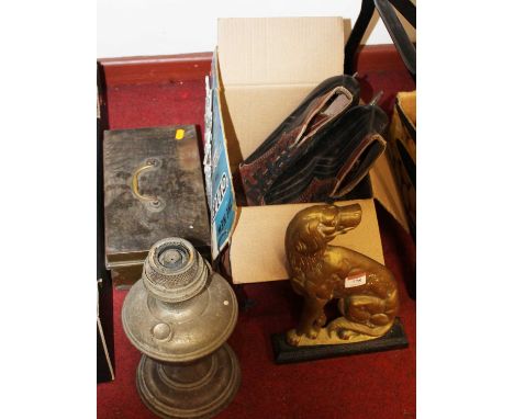 A 19th century style brass door stop in the form of a seated dog, together with an oil lamp, pair of ice skates etc