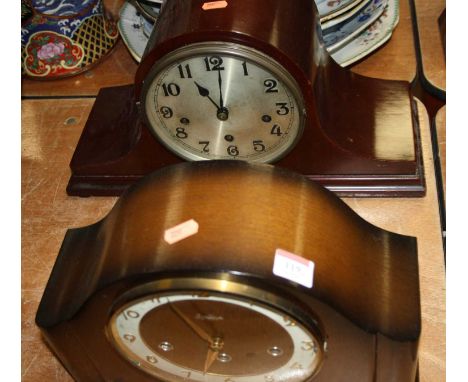 A 1960s oak cased mantel clock, the eight day movement with chimes, the chapter ring showing Arabic numerals, mounted with pr