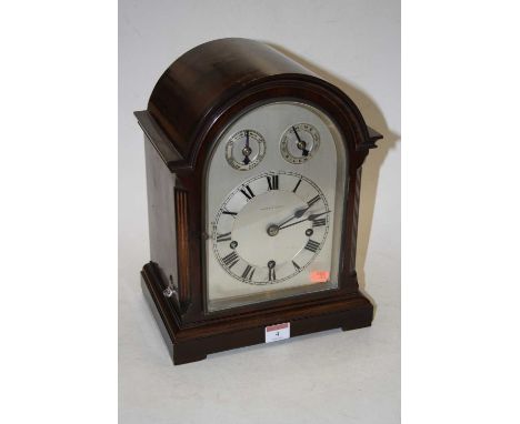 An early 20th century mahogany cased bracket clock, the arched dial with subsidiary speed and chime/silent dials, the silvere