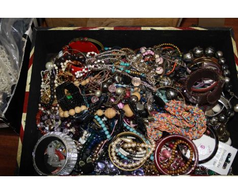 A box of miscellaneous costume jewellery to include various perspex and other bracelets, beaded necklaces, polished ?? bangle