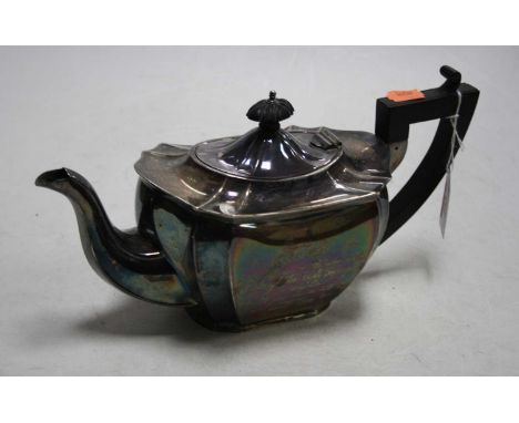 A George V silver teapot of shaped rectangular form having an ebonised finial and handle with presentation inscription dated 