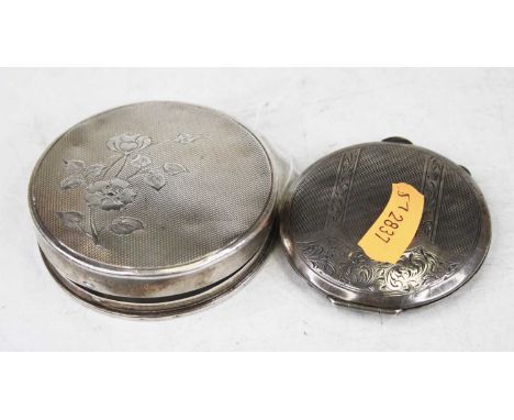 An early 20th century Continental silver ladies powder compact of circular form, the lid with floral engraved and engine turn
