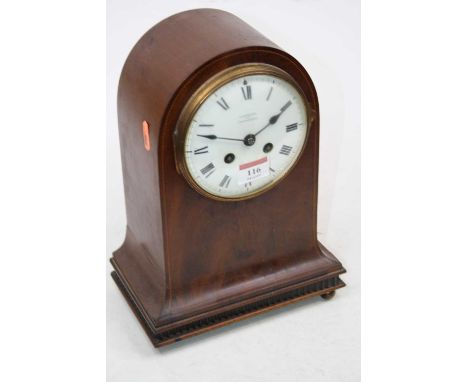 An Edwardian mahogany and chequer strung mantel clock, having a convex enamel dial signed Finnegans Ltd, Manchester, Roman nu