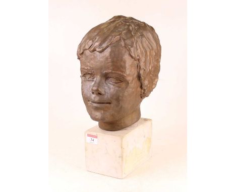 A 20th century plaster portrait head of a young boy, upon a veined white marble plinth, h.35cm