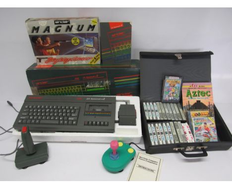 A boxed Sinclair ZX Spectrum +2 vintage computer gaming console, together with Sinclair SJS-1 joystick, Power Play Cruiser jo