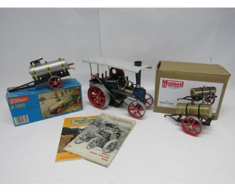 A Wilesco live steam traktor traction engine, finished in blue with red wheels and white canopy, together with a boxed Wilesc