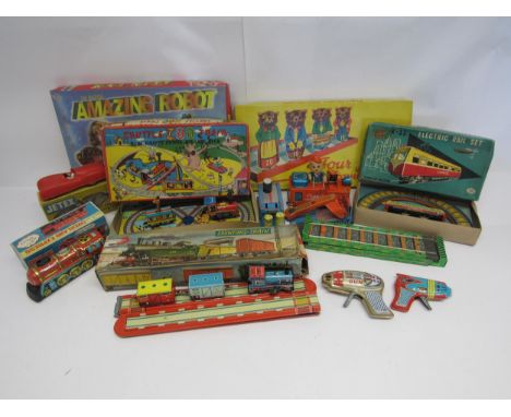 Three boxed Japanese tinplate toy vehicles and novelty toys ito include Masudaya clockwork R-11 Electric Rail Set, Yone Overl