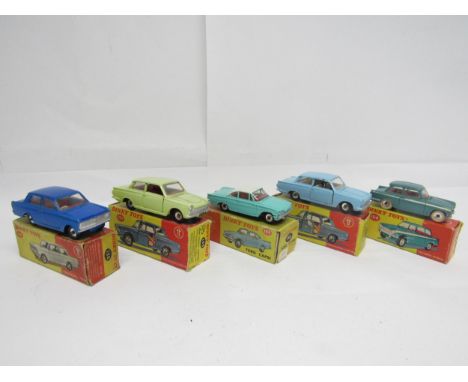 Five Dinky Toys diecast model cars, housed in yellow and red pictorial card boxes, to include 134 Triumph Vitesse in metallic