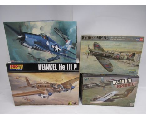 Four 1:32 scale military aircraft plastic model kits to include Kitty Hawk KH32004 OV10 A/C "Bronco", Hasegawa F6F-3/5 Hellca