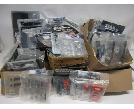 A large collection of Fanhome The Fast &amp; The Furious magazines and 1:8 scale Dodge Charger model parts 
