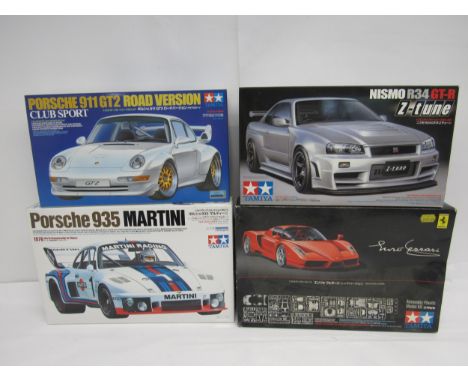 Four Tamiya racing and and road car plastic model kits to include 1:20 scale 20070 Porsche 935 Martini and 1:24 scale 24302 E
