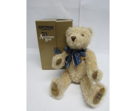 A boxed Merrythought limited edition 70th Anniversary teddy bear with amber and black plastic eyes, stitched nose and mouth, 