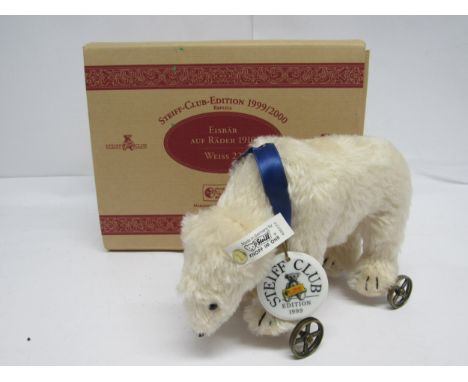A boxed Steiff Club Edition 1999, 420177 Eisbar Polar Bear, the white mohair bear on metal wheels with gold coloured button a