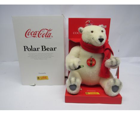A boxed Steiff limited edition 670336 white mohair Coca-Cola polar bear with plastic eyes and nose, stitched mouth and paws, 