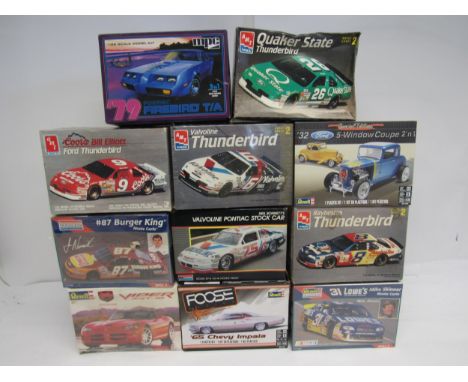 A collection of racing and road car plastic model kits to include AMT ERTL 1:25 scale 6962 Coors Bill Elliott Ford Thunderbir