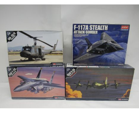 Four Academy military plastic model kits to include 1:48 scale 12265 F-117A Stealth Attack-Bomber, 12308 UH-1DH helicopter an