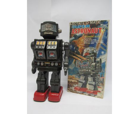 A Horikawa (SH Toys of Japan) battery operated Rotate-O-Matic Super Astronaut robot, dark metallic grey tinplate body with re