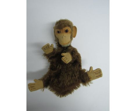 A vintage brown plush monkey glove puppet with felt face, hands and feet, 20cm tall 