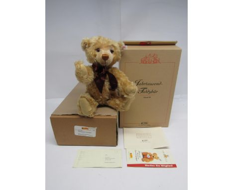 A boxed Steiff limited edition 670374 Millennium Bear, the articulated blonde mohair teddy bear with plastic eyes, stitched n