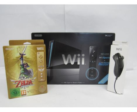 A boxed Nintendo Wii Sports Resort Pack computer game console in black, together with a boxed The Legend Of Zelda Skyward Swo