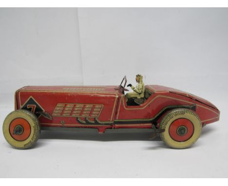 A British made clockwork tinplate racing car, probably by Mettoy, the red, cream and black car with driver, windscreen and Du