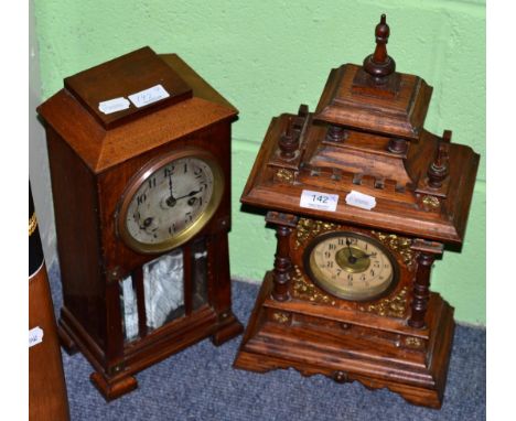 A 19th century oak cased striking mantle clock, together with an early 20th century example