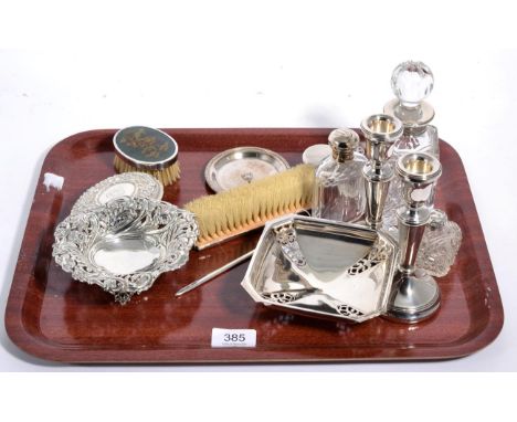 A group of silver items, including: various silver topped glass jars and bottles; a silver and enamel dressing table brush; a