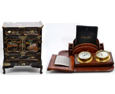 A Japanese mother of pearl inlaid lacquered cabinet (a.f.), a wall mounted brass clock and barometer, burr walnut picture fra