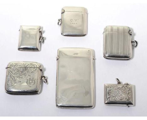 A silver vesta case, William Hair Haseler, Birmingham 1913, with striped engraving; two further English silver vesta cases; t