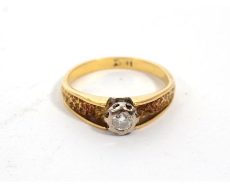 A solitaire diamond ring, a round brilliant cut diamond in an illusion setting, to carved textured shoulders, estimated diamo