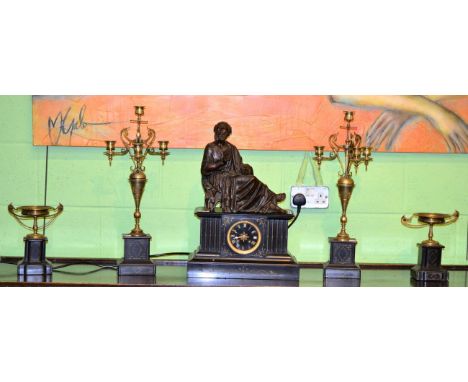 A Victorian figural gilt metal and slate five piece striking clock garniture comprising clock, a pair of four light candelabr