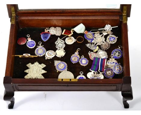 A collection of silver, base metal and enamel medals and badges, including: a silver ARP badge; Masonic Benevolent Institutio