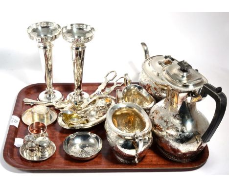 A small group of silver comprising a pair of bud vases (weighted); a miniature four piece condiment set; napkin ring; a caddy