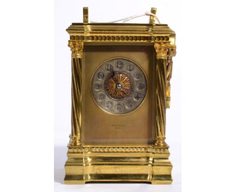 A brass striking carriage clock, dial signed Reid & Sons, Paris, the case with spirally fluted Corinthian columns