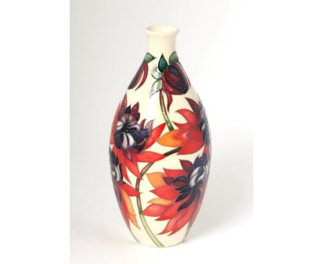 A modern Moorcroft pottery TRIAL vase in the Ruby Red pattern, dated 22.10.02 with painted and impressed marks, 24cm