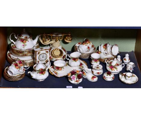 A quantity of Royal Albert Old Country Roses ceramics including tea and dinner wares, a telephone, a pair of lamps, a clock, 