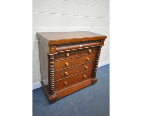 A VICTORIAN STAINED PINE SCOTTISH CHEST OF TWO SHORT AND FOUR LONG DRAWERS, including a wavy front drawer, and bobbin turned 