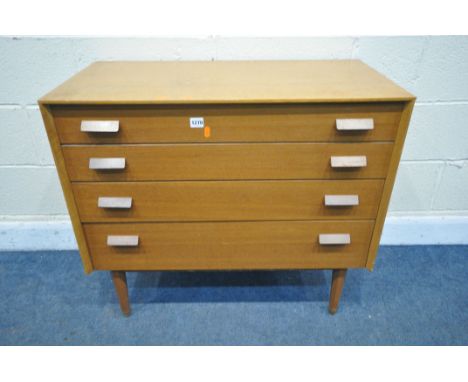 A MID CENTURY E-GOMME/G-PLAN LIGHT OAK AND TEAK CHEST OF FOUR DRAWERS, on cylindrical legs, width 85cm x depth 44cm x height 