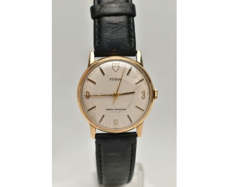 A GENTS 9CT GOLD 'TUDOR' WRISTWATCH, manual wind, round silvered dial signed 'Tudor Shock-Resisting', Tudor emblem at the twe