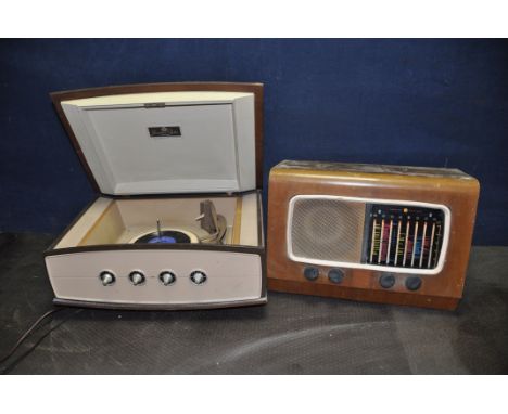 A VINTAGE PYE MODEL 1005 'SPACE SHIP' TURNTABLE with a walnut veneered case, cream plastic front panel with turned and taperi