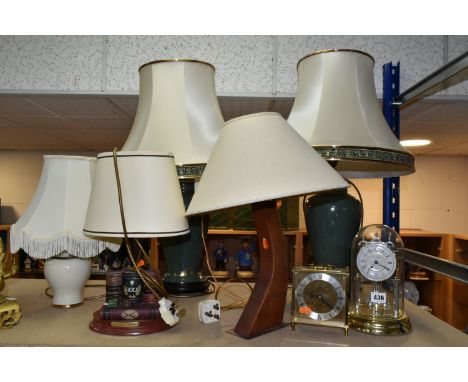 A GROUP OF LAMPS AND CLOCKS, to include a pair of green ceramic table lamps with cream shades, height to top of fitting appro