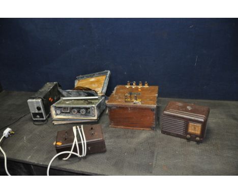 A VINTAGE FADA VALVE RADIO IN BROWN BAKELITE CASE, a very distressed Pye car radio, an Ekco Power unit in Bakelite case, a Py